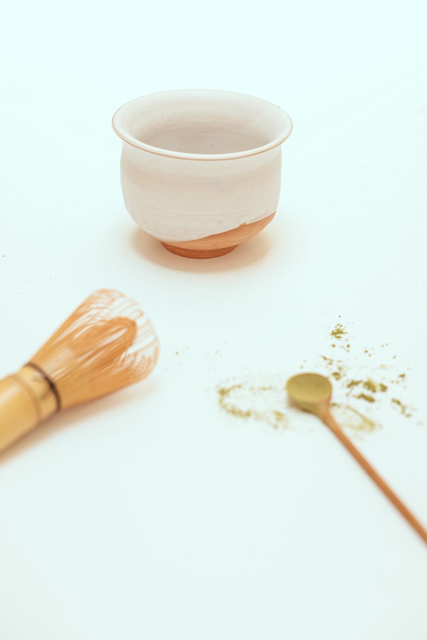 Ceremonial bowl of matcha with hand-carved bamboo whisk