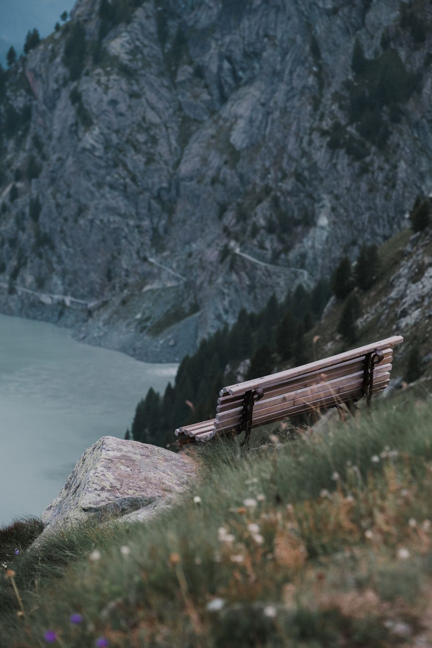 Quiet bench overlooking scenic lake and distant hills